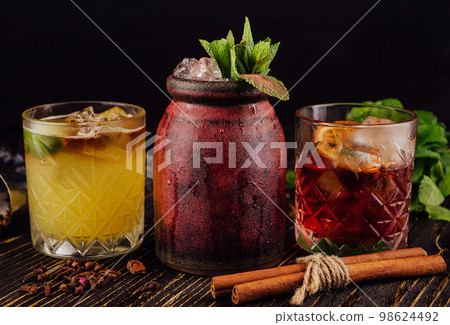 three different alcoholic cocktails with old-fashioned glasses three different alcoholic cocktails with old-fashioned glasses 98624492