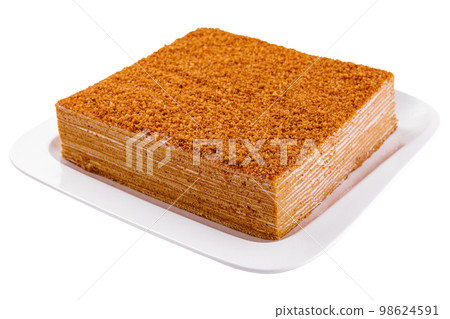 Sweet home layered honey cake on plate Sweet home layered honey cake on plate 98624591