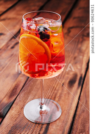 Delicious sangria cocktail on wooden table Delicious sangria cocktail on wooden table 98624631