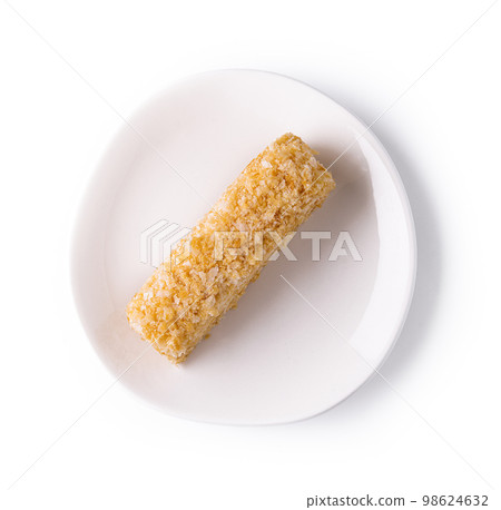 Napoleon Cake on a white plate isolated Napoleon Cake on a white plate isolated 98624632