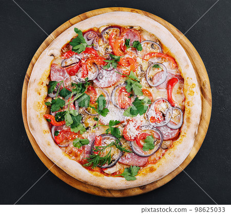 Delicious pizza isolated on a black background 98625033