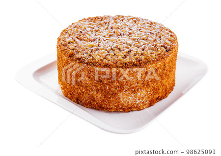Homemade honey cake on white plate Homemade honey cake on white plate 98625091