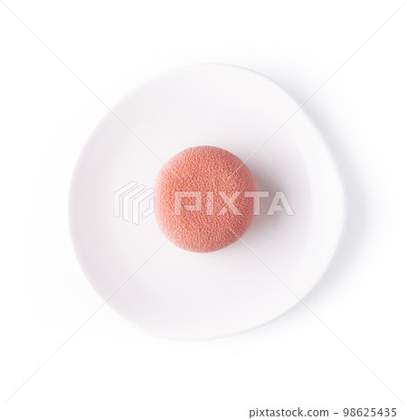 Pink mousse cake on white plate Pink mousse cake on white plate 98625435