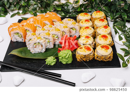 different sushi rolls on a big plate different sushi rolls on a big plate 98625450