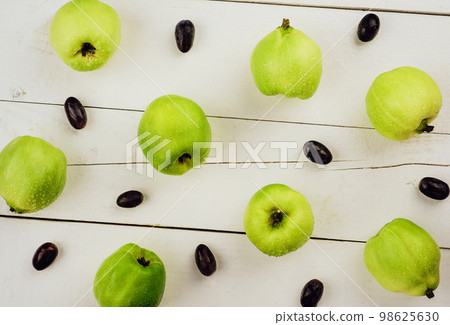 Ripe golden yellow quince fruits on wood Ripe golden yellow quince fruits on wood 98625630