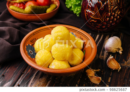 cheese balls with garlic inside in bowl 98625687