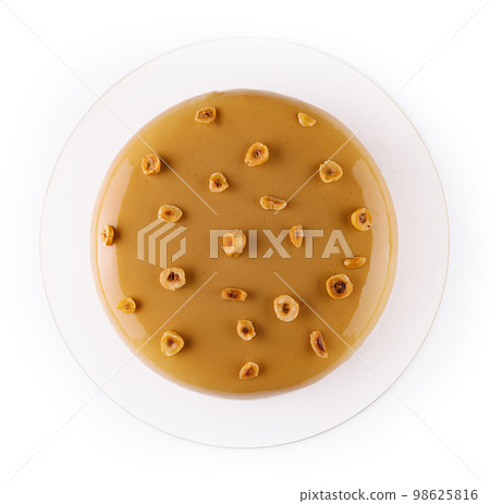 Sweet caramel cake with hazelnut and moouse 98625816