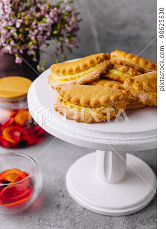 Homemade buns with cottage cheese and tea Homemade buns with cottage cheese and tea 98625830