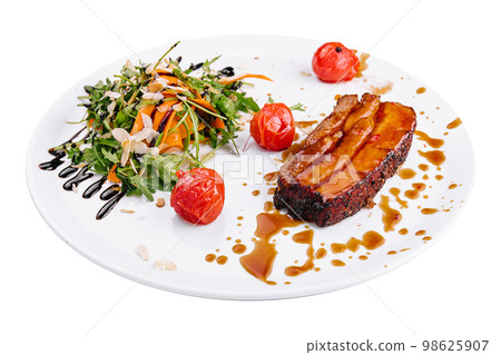 Tasty pork rib baked under sauce on plate 98625907