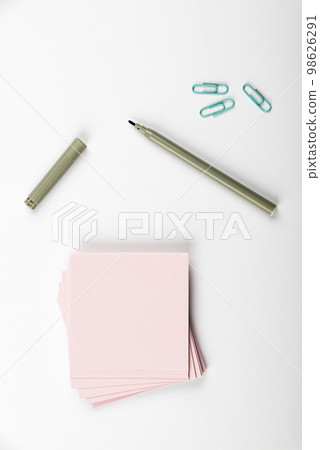 Notebook and Colored Papers Stickers Lying On White Desk. Multiple Assorted Collection Office Stationery. Photo With Pens Pencils Rullers Calculators. Notebook and Colored Papers Stickers Lying On White Desk. Multiple Assorted Collection Office Stationery. Photo With Pens Pencils Rullers Calculators. 98626291