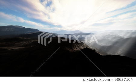 Alpine chains shrouded in the morning fog 98627104