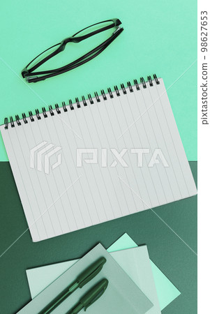 Image with school supplies, colored stickers, notebooks. Pens, pencils, rullers, calculator, keyboard. Assortment office items. Important information written on paper. 98627653