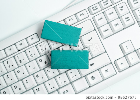 Colored wood cube with important message lying near keyboard. Main information written on notebook. School supplies. Multiple Assorted Collection Office Stationery. Colored wood cube with important message lying near keyboard. Main information written on notebook. School supplies. Multiple Assorted Collection Office Stationery. 98627673