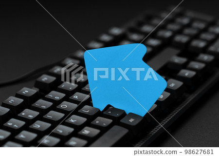 Colored sticker lying on black keyboard. Important information written over paper. Image with school supplies. Multiple Assorted Collection Office Stationery. Colored sticker lying on black keyboard. Important information written over paper. Image with school supplies. Multiple Assorted Collection Office Stationery. 98627681