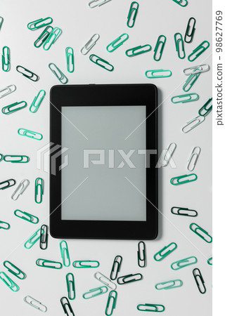 Tablet Screen With Important Ideas On It And green paperclips On Desk around the device. Cellphone With Crutial Informations And Memo Attached To It. Tablet Screen With Important Ideas On It And green paperclips On Desk around the device. Cellphone With Crutial Informations And Memo Attached To It. 98627769