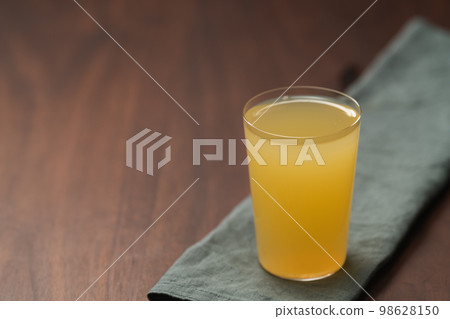 Lemonade in tumbler glass on linen napkin with copy space Lemonade in tumbler glass on linen napkin with copy space 98628150