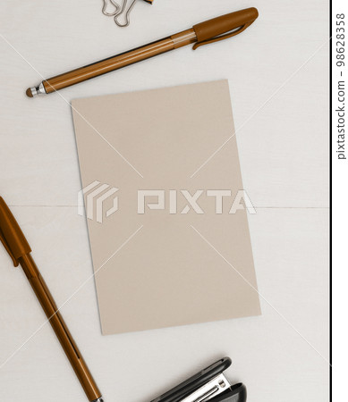 Image with school supplies, colored stickers, notebooks. Pens, pencils, rullers, calculator, keyboard. Assortment office items. Important information written on paper. 98628358