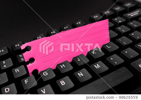 Colored sticker lying on black keyboard. Important information written over paper. Image with school supplies. Multiple Assorted Collection Office Stationery. Colored sticker lying on black keyboard. Important information written over paper. Image with school supplies. Multiple Assorted Collection Office Stationery. 98628359