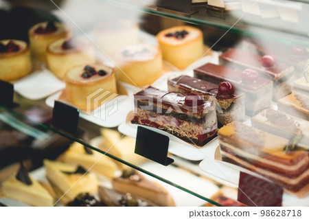a piece of cake at a shop window confectionery a piece of cake at a shop window confectionery 98628718