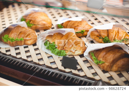 croissant at the shop window of the confectionery shop croissant at the shop window of the confectionery shop 98628724