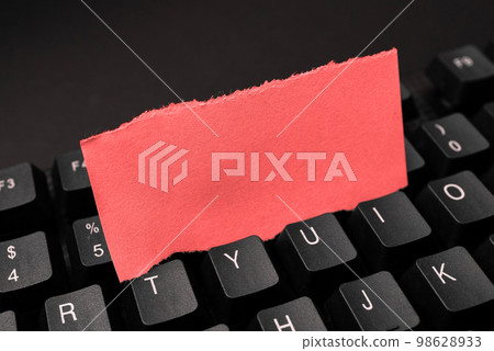 Colored sticker lying on black keyboard. Important information written over paper. Image with school supplies. Multiple Assorted Collection Office Stationery. Colored sticker lying on black keyboard. Important information written over paper. Image with school supplies. Multiple Assorted Collection Office Stationery. 98628933