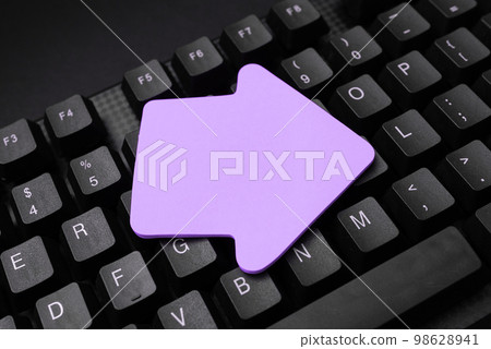 Colored sticker lying on black keyboard. Important information written over paper. Image with school supplies. Multiple Assorted Collection Office Stationery. Colored sticker lying on black keyboard. Important information written over paper. Image with school supplies. Multiple Assorted Collection Office Stationery. 98628941