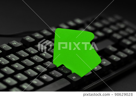 Colored sticker lying on black keyboard. Important information written over paper. Image with school supplies. Multiple Assorted Collection Office Stationery. Colored sticker lying on black keyboard. Important information written over paper. Image with school supplies. Multiple Assorted Collection Office Stationery. 98629028