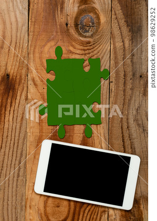 Mobile Phone With Important Message On Desk With Empty Dark Green Puzzels And Notes. Cellphone Screen With Crutial Informations On Table With Notepad And Memos. Mobile Phone With Important Message On Desk With Empty Dark Green Puzzels And Notes. Cellphone Screen With Crutial Informations On Table With Notepad And Memos. 98629252