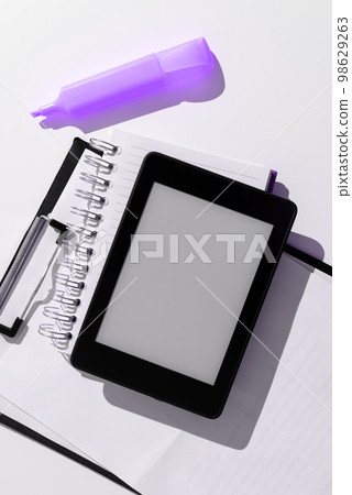 Tablet Screen With Important Ideas On It And Note Sticked On It On Desk With Notebook And Marker. Cellphone With Crutial Informations And Memo Attached To It. Tablet Screen With Important Ideas On It And Note Sticked On It On Desk With Notebook And Marker. Cellphone With Crutial Informations And Memo Attached To It. 98629263
