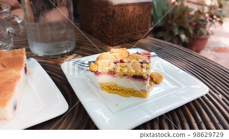 A piece of traditional Streuselkuchen or the classic German crumb cake at a cafe A piece of traditional Streuselkuchen or the classic German crumb cake at a cafe 98629729