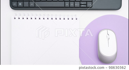 Colored paper with important message lying desk near keyboard. Main information written on notebook. School supplies. Multiple Assorted Collection Office Stationery. Colored paper with important message lying desk near keyboard. Main information written on notebook. School supplies. Multiple Assorted Collection Office Stationery. 98630362