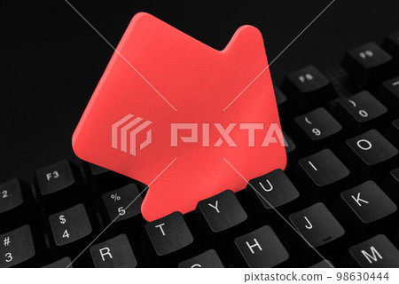 Colored sticker lying on black keyboard. Important information written over paper. Image with school supplies. Multiple Assorted Collection Office Stationery. Colored sticker lying on black keyboard. Important information written over paper. Image with school supplies. Multiple Assorted Collection Office Stationery. 98630444