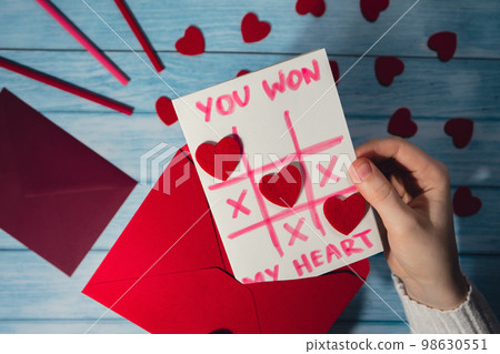 Valentines Day. Instructions for making valentine cards. Text YOU WON MY HEART and tic tac toe game Postcard craft, greeting card. DIY Step by step instruction. Making of handmade Valentine greeting 98630551