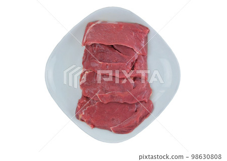 Beef steaks in plate isolated in white background. Raw meat for cooking. Top view. Beef steaks in plate isolated in white background. Raw meat for cooking. Top view. 98630808