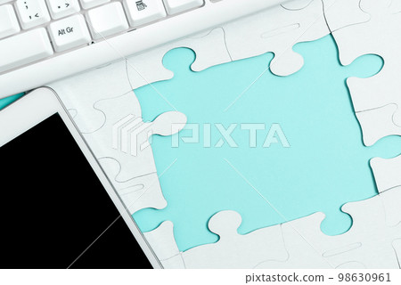 Colored Paper Puzzles Lying On Table. Important Text Written Over Paper. Office Stationery Around School Accessories, Pens, Pensils, Computer Keyboard. Colored Paper Puzzles Lying On Table. Important Text Written Over Paper. Office Stationery Around School Accessories, Pens, Pensils, Computer Keyboard. 98630961