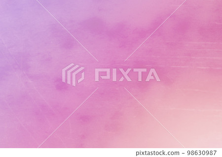 Blurred vintage pink gradient background with spots and scratches. 98630987