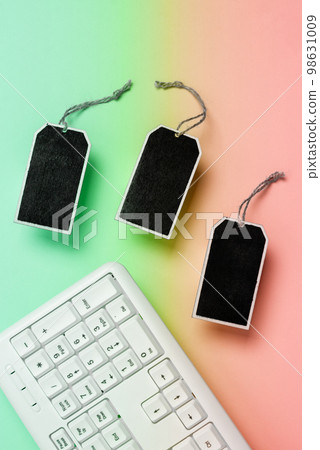 Colored paper with important message lying desk near keyboard. Main information written on notebook. School supplies. Multiple Assorted Collection Office Stationery. Colored paper with important message lying desk near keyboard. Main information written on notebook. School supplies. Multiple Assorted Collection Office Stationery. 98631009