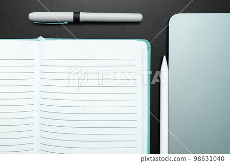 Photo With Pens Pencils Rullers Calculators. Notebook and Colored Paper Stickers Lying On White Desk. Multiple Assorted Collection Office Stationery. Postcards. Photo With Pens Pencils Rullers Calculators. Notebook and Colored Paper Stickers Lying On White Desk. Multiple Assorted Collection Office Stationery. Postcards. 98631040