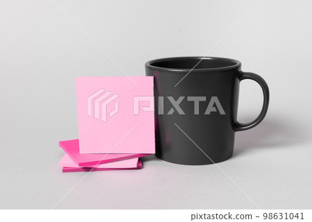 Coffee Cup Standing on Desk. Important infrormation written on paper. Different Office Supplies, Pencils, Pens, Marckers. Computer keyboard. Text on wood table. Coffee Cup Standing on Desk. Important infrormation written on paper. Different Office Supplies, Pencils, Pens, Marckers. Computer keyboard. Text on wood table. 98631041