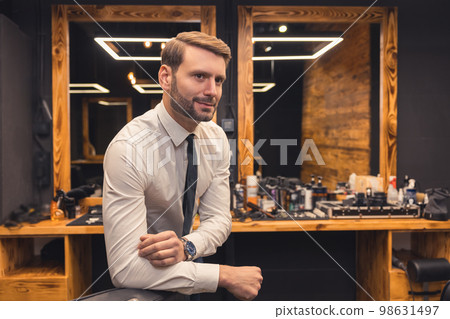 Fair-haired stylish young man in a barbershop 98631497