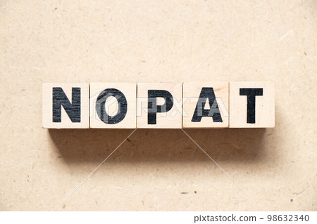 Alphabet letter block in word NOPAT (Abbreviation of net operating profit after tax) on wood background Alphabet letter block in word NOPAT (Abbreviation of net operating profit after tax) on wood background 98632340