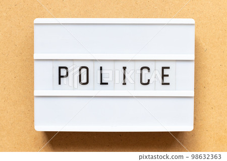 Lightbox with word police on wood background 98632363