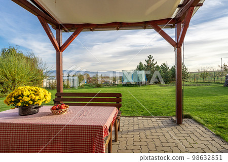 table on the paved terrace with a view of the garden 98632851