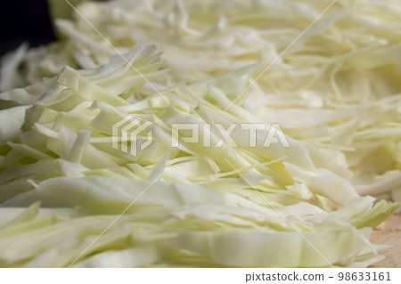 Sliced white cabbage on the table Sliced white cabbage on the table 98633161