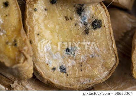 Spoiled and covered with mold sliced ginger Spoiled and covered with mold sliced ginger 98633304