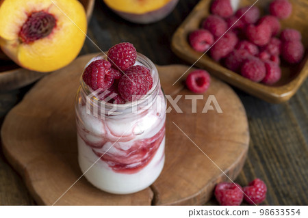 yogurt with fresh berries and raspberry jam yogurt with fresh berries and raspberry jam 98633554