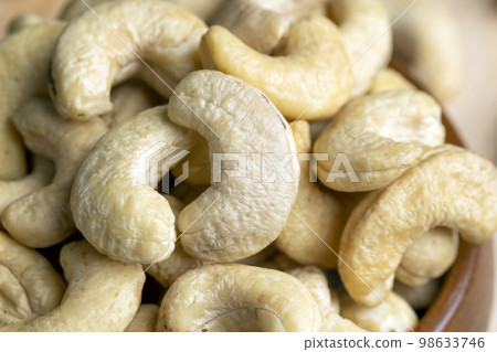 fresh cashew nuts on the table 98633746