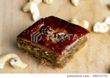 A piece of fresh and soft baklava A piece of fresh and soft baklava 98633770