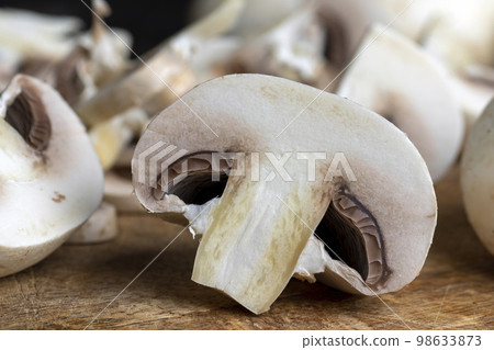 Cooking a dish of mushrooms cut into pieces 98633873