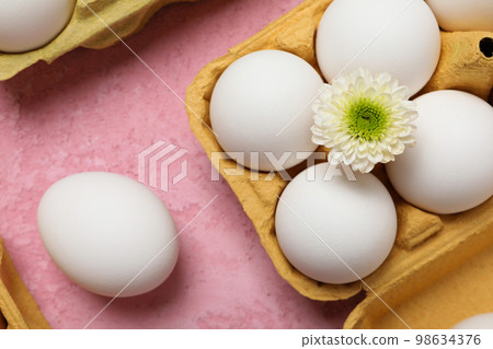 Concept of spring, eggs with flowers, top view Concept of spring, eggs with flowers, top view 98634376